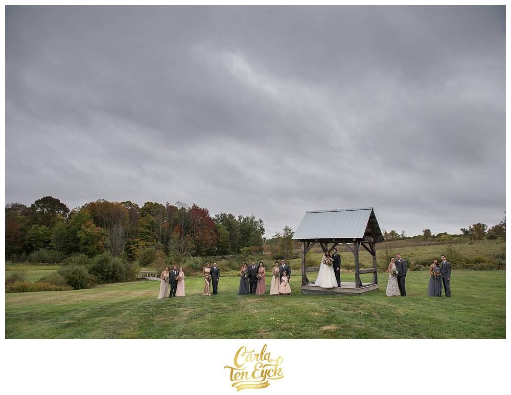 A wedding party in the field at South Farms at a wedding in Morris CT