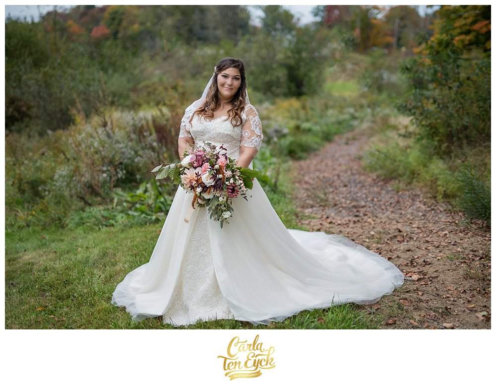 A bride on the grounds of South Farms at her wedding in Morris CT