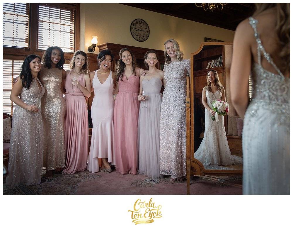 Bridesmaids in pink and champagne gowns at wedding at Mansion on Turner Hill Ipswich MA