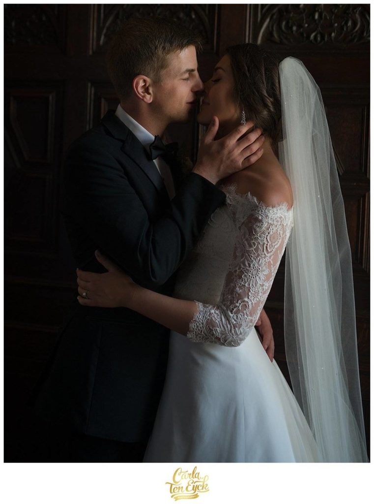 A bride and groom kiss at their wedding at the Branford House in Groton CT