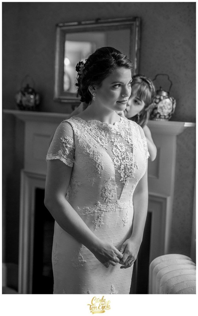 A bride gets ready at her wedding at the Bee and Thistle Inn in Old Lyme CT