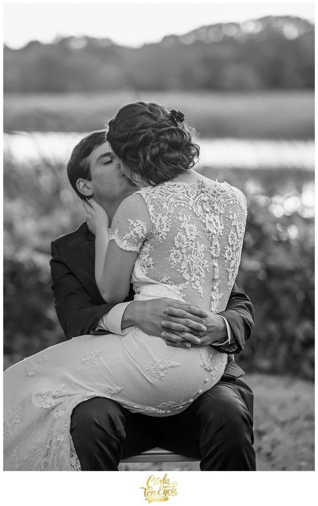 A couple snuggles at their wedding at The Bee and Thistle Inn in Old Lyme CT