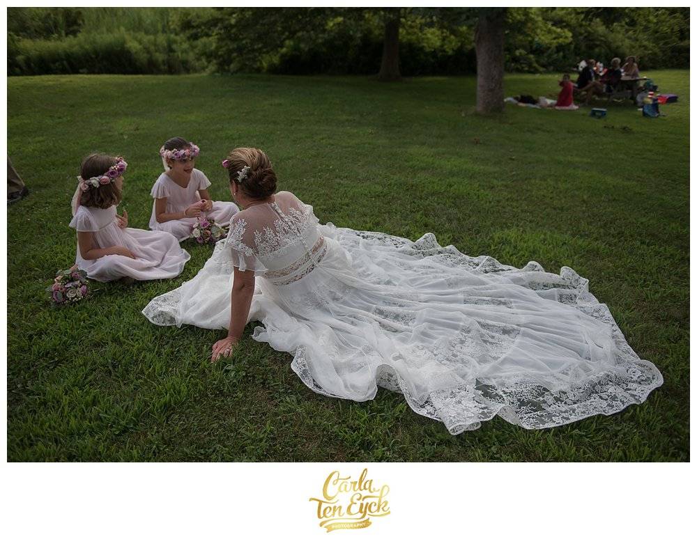 Bride relaxes in her Rivini wedding gown at Harkness Park, Waterford CT