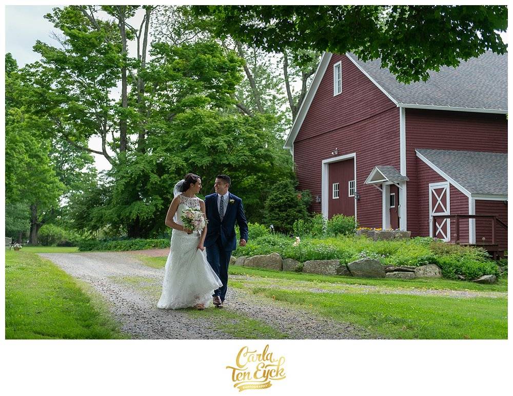 Bride and Groom walking at their wedding at Tyrone Farm in Pomfret CT
