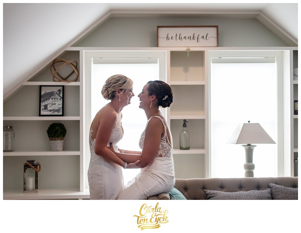 Bridal suite at Jonathan Edwards Winery with two brides laughing
