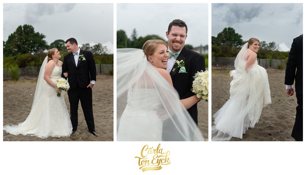 Happy bride and groom on the beach in the rain in Augusta Jones wedding gown in Lordship CT