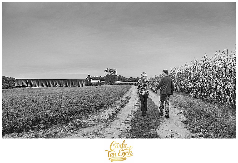 Couple walks on a farm in Suffield CT during their engagement session