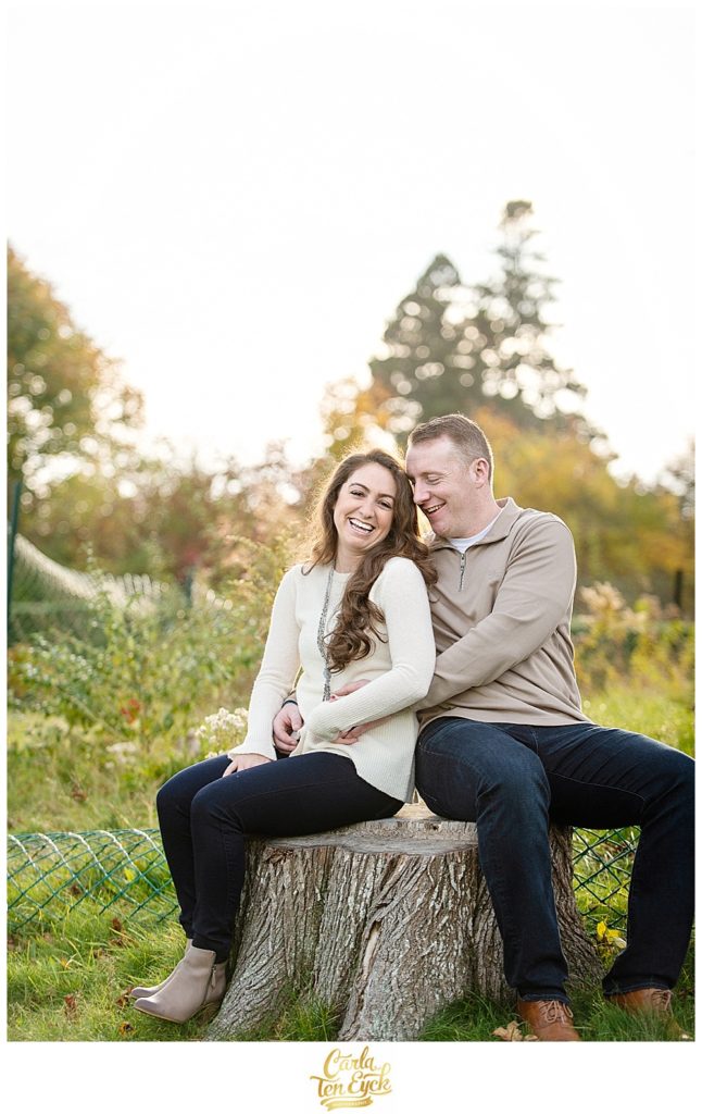 A couple laughs during their Autumn engagement session at Harkness Park in Waterford CT