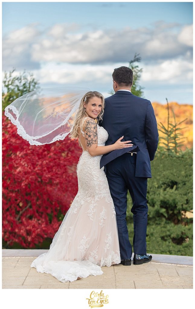 Bride and groom in Stella York wedding gown at their autumn wedding at Aria in Prospect CT