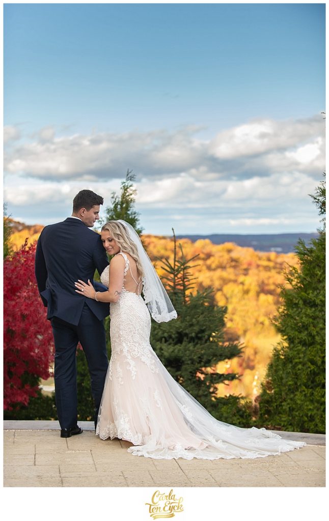 Bride and groom embrace at their autumn wedding at Aria in Prospect CT