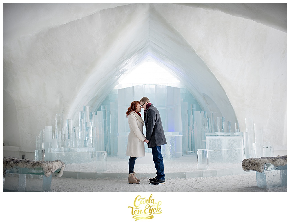 A couple embraces at the chapel at the ice hotel de Glace in Montreal Quebec