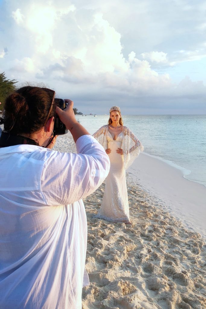 Carla Ten Eyck photographs a model on Seven Mile Beach in Grand Cayman for Cayman Vows Magazine