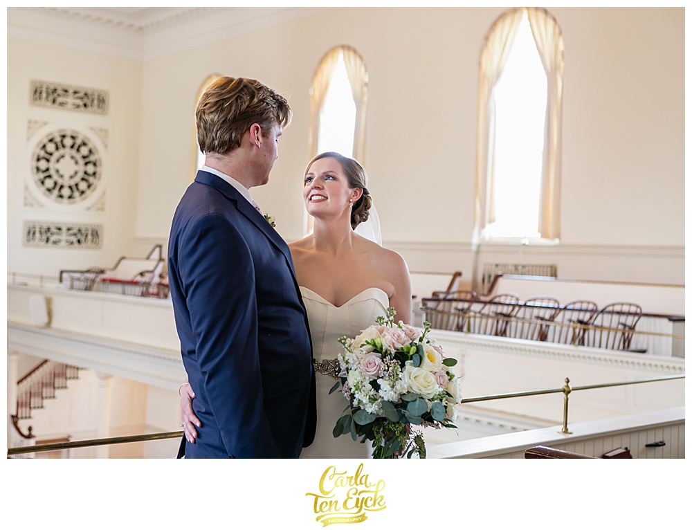 Bride smiles at her groom after their wedding at First Congregational church in Danbury CT