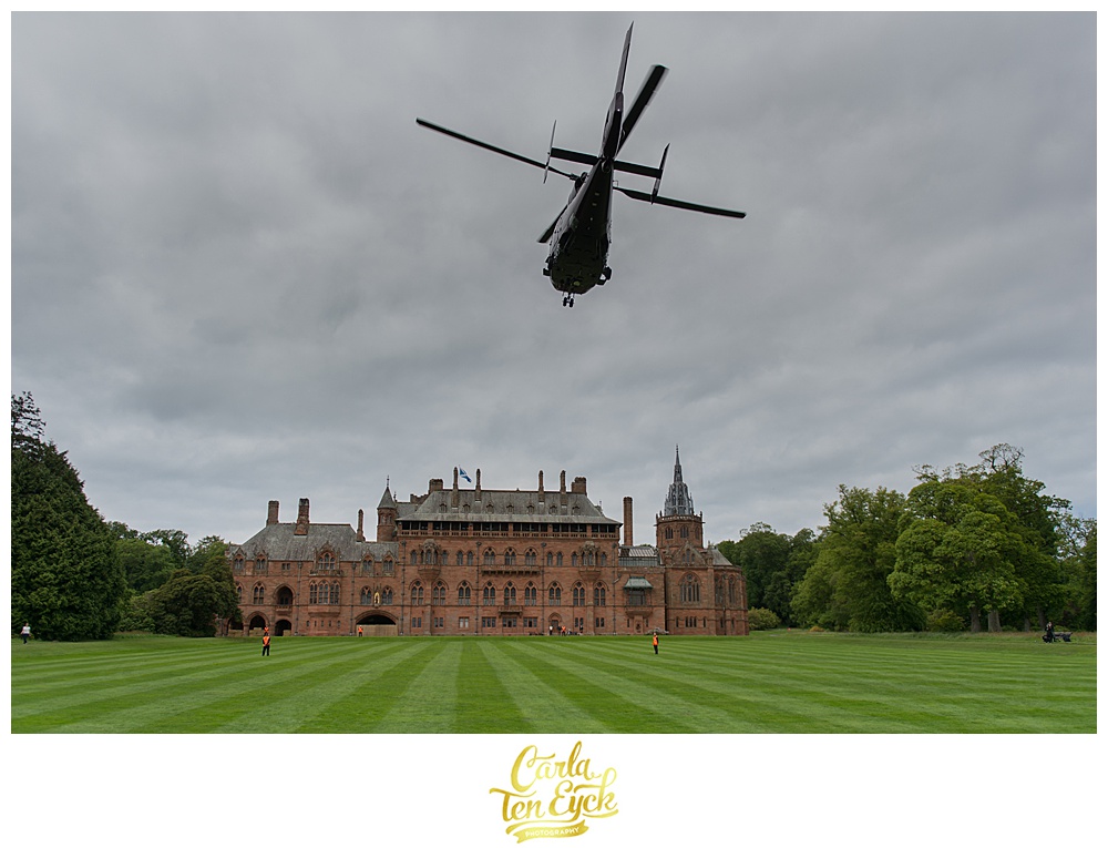 Bride and groom land via helicopter at Mount Stuart Castle on the Isle of Bute Scotland
