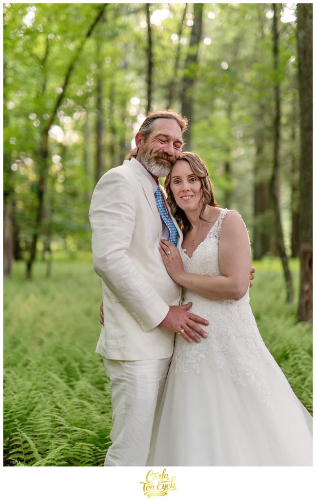 Bride and groom in a fern grove after their backyard CT wedding