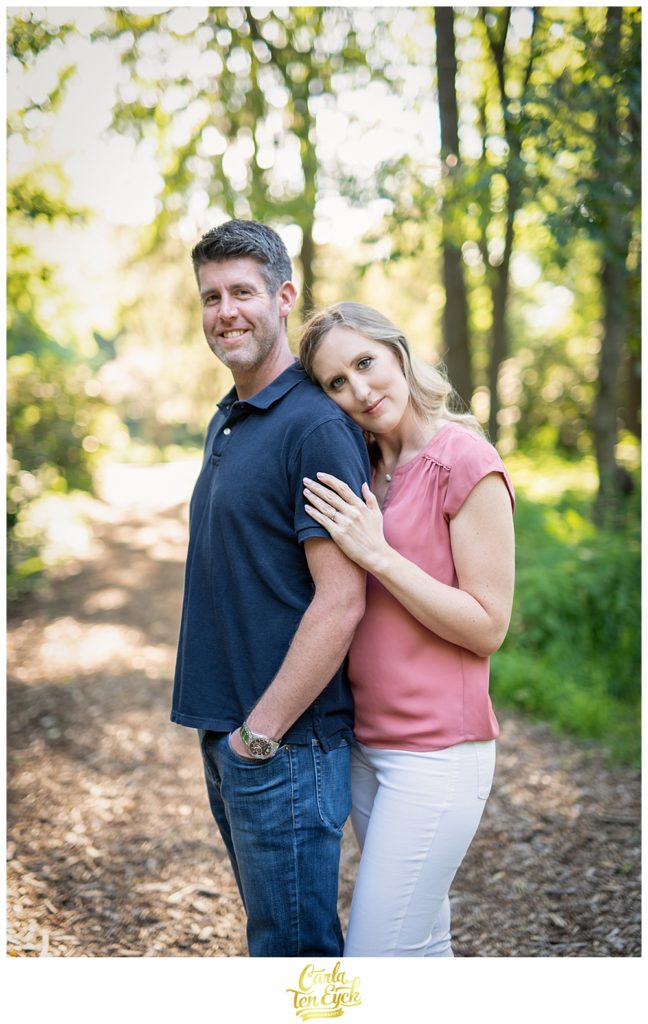Couple snuggles during their Hartford engagement session in Elizabeth Park