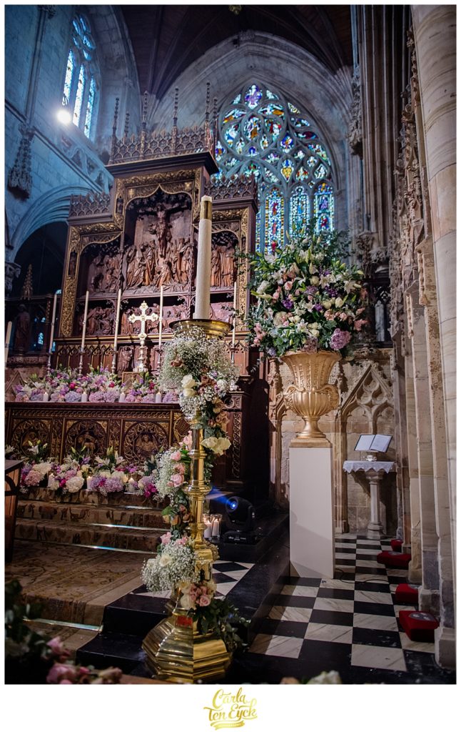 Wedding florals at the altar in Selby Abbey Yorkshire UK