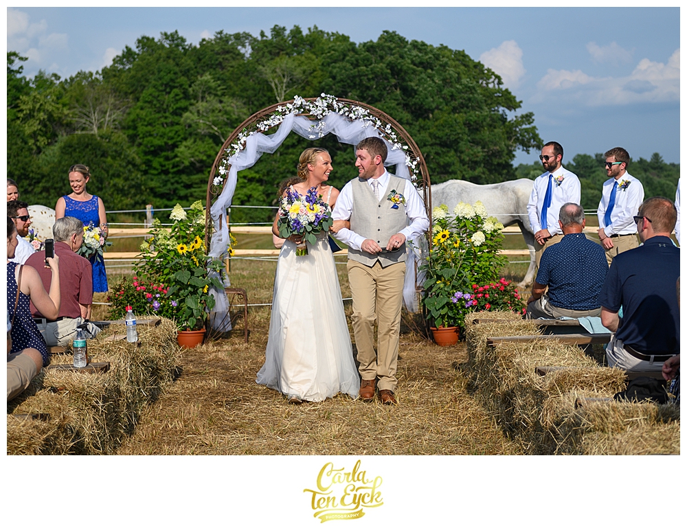 Just married a bride and groom celebrate down the aisle at Flamig Farm Simsbury CT