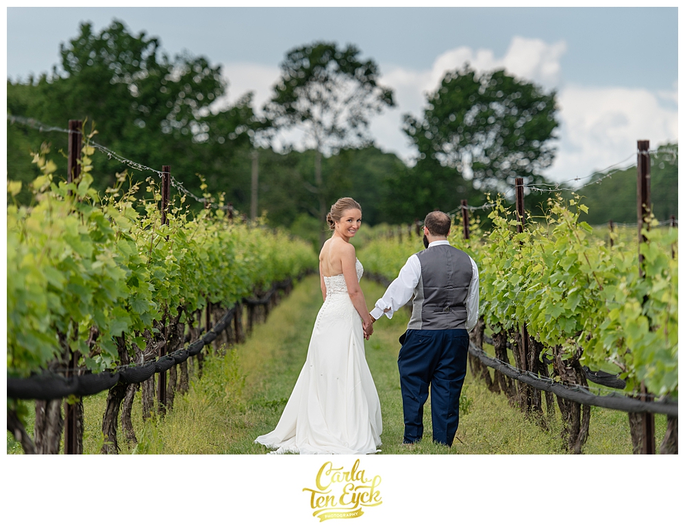Bride and groom in the vineyard at Jonathan Edwards winery wedding in North Stonington CT