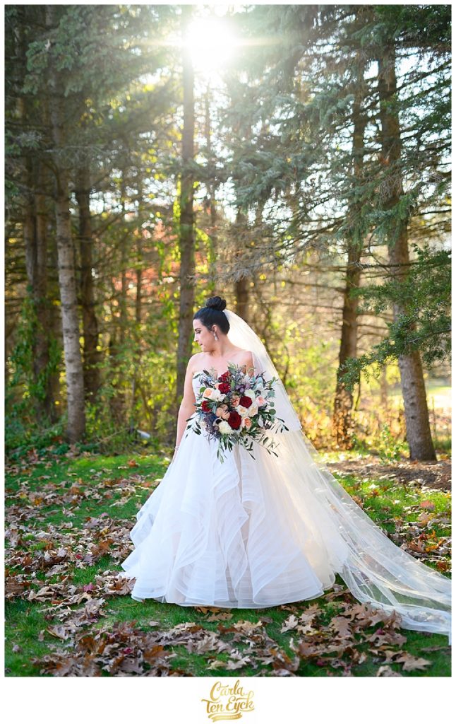 A bride in her wedding gown by WTOO at her wedding at Vyne Restaurant Middlebury CT