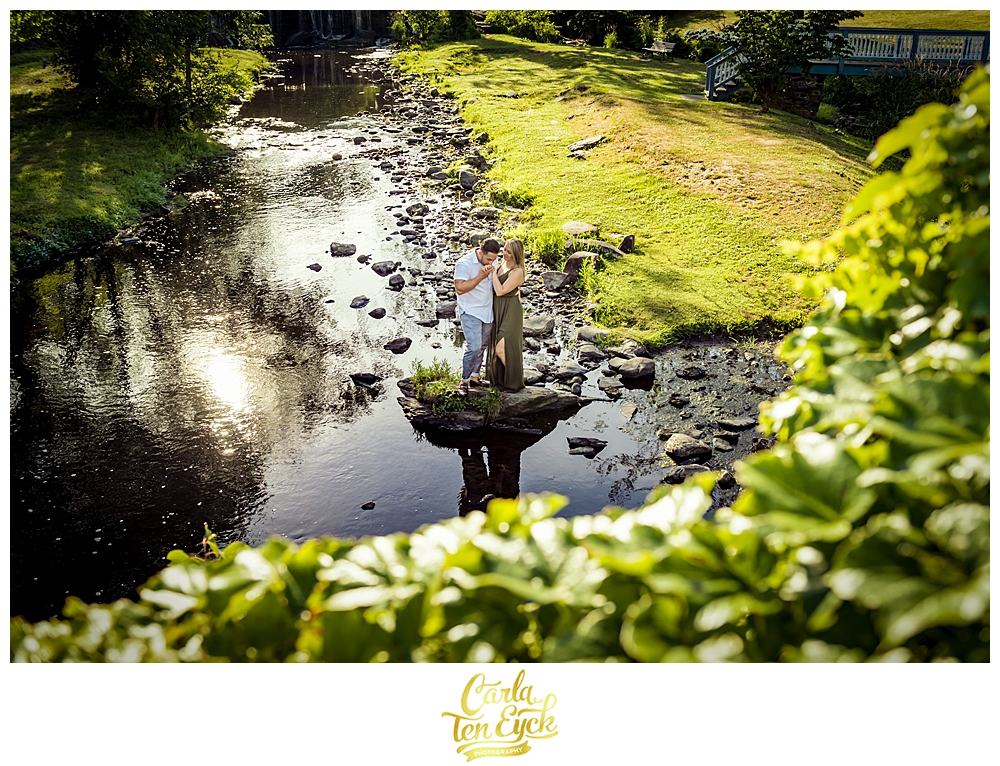 A couple enjoys the waterfalls during their Milford CT engagement session