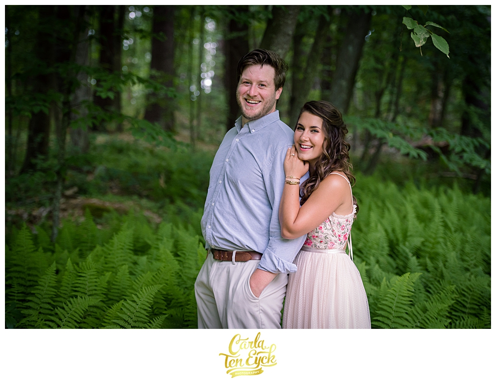 Couple poses for photos during their rustic micro wedding 