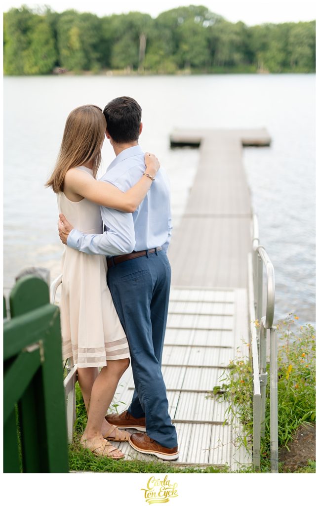 Couple embraces on Lake Waramaug in New Preston CT during their engagement session