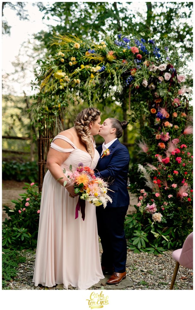 Two brides kiss at their intimate LGBTQ wedding in Weston CT