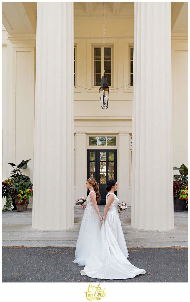 Two brides during their first look at their wedding at The Wadsworth Mansion at Long Hill, Middletown CT