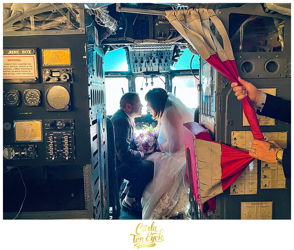 Bride and groom pose in the helicopter suite on their wedding day at the Winvian Farm in Morris CT