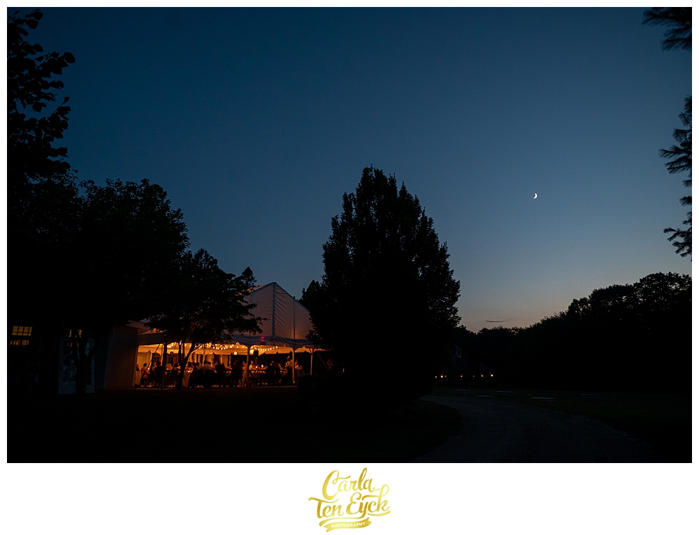 A tent glows at night at a Winvian wedding in Morris CT