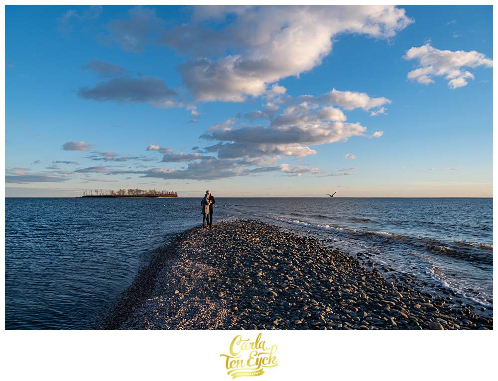 Two grooms brave the cold on the beach at Silver Sands in Milford CT during their engagement session
