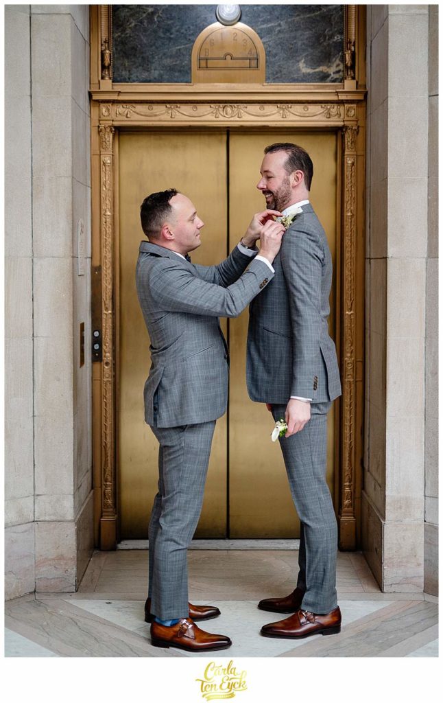 Two grooms prepare for their elopement at Hartford City Hall in Hartford CT