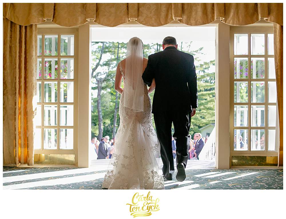 A bride and her Dad walk down the aisle at her Fox Hill Inn Wedding in Brookfield CT