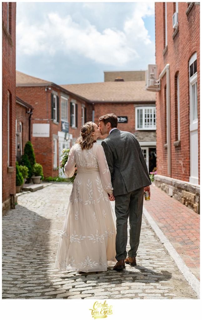 A couple kisses in a side street during their Litchfield wedding in Litchfield CT