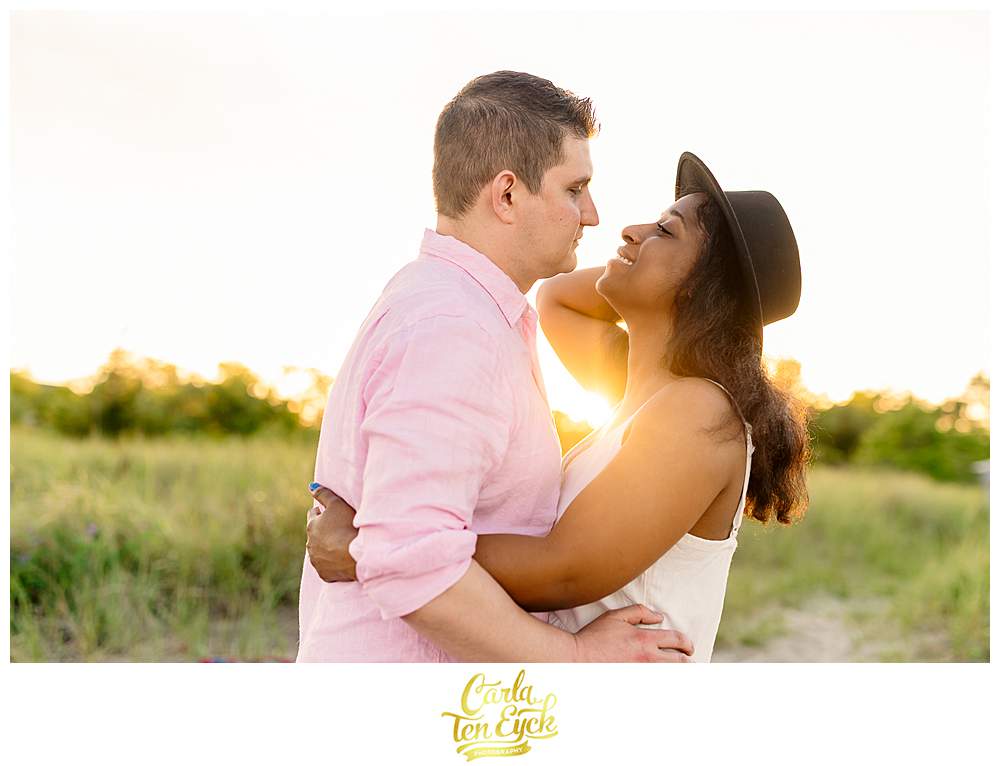 A couple kisses during their engagement session at the Milford Audubon Society in Milford CT