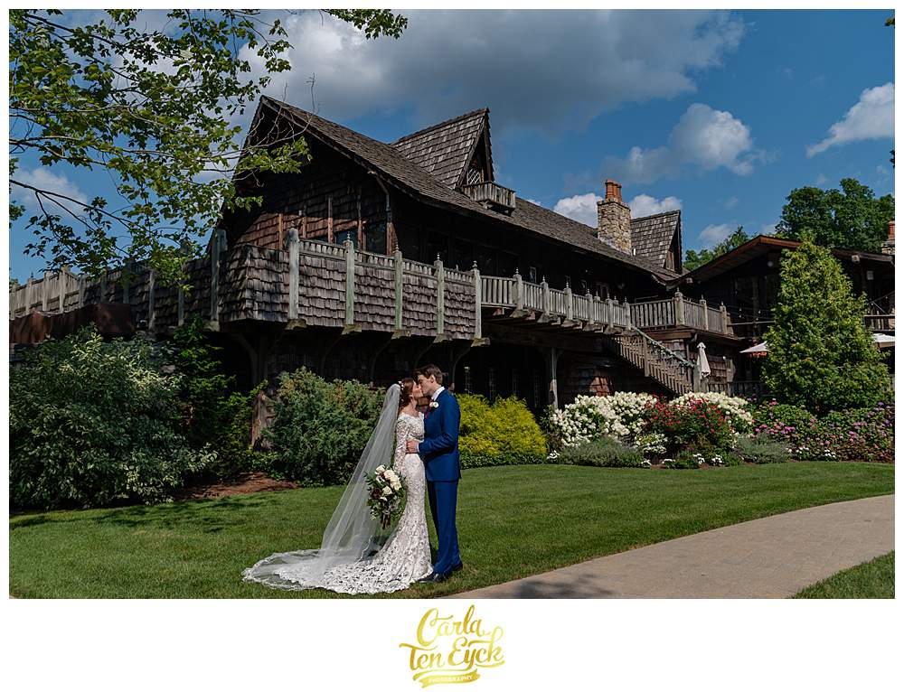 A bride and groom pose for photographs at their Bill Miller's Castle wedding in Branford CT