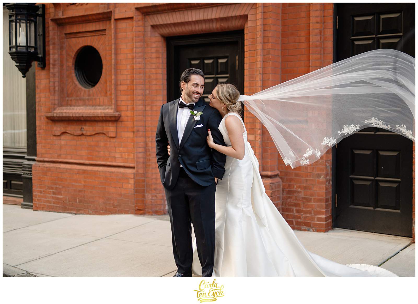 A couple poses for photos at their Goodwin Hotel Wedding in Hartford CT