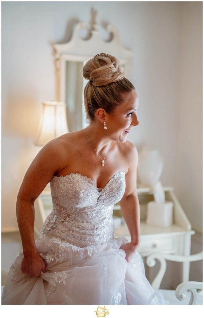 A bride gets ready for her winter Lord Thompson Manor wedding in Thompson CT