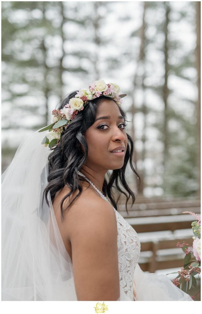 A bride poses for photos during her wedding at The Pavilion at Crystal Lake in Middletown, CT