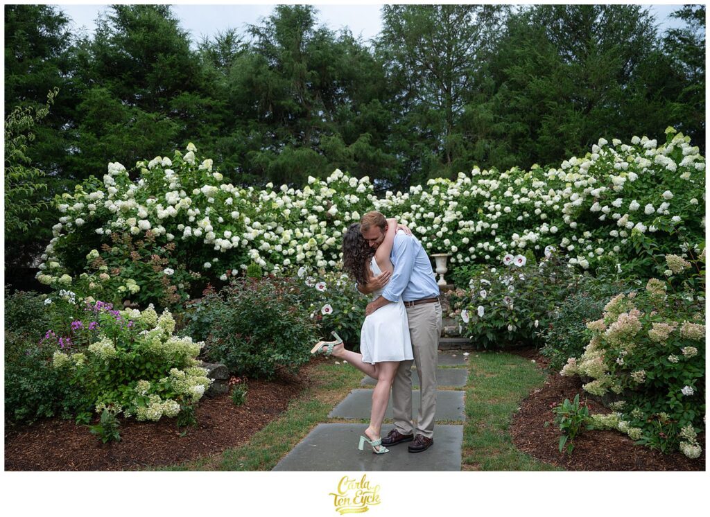 A couple hugs during their engagement session at the Wadsworth Mansion in Middletown CT