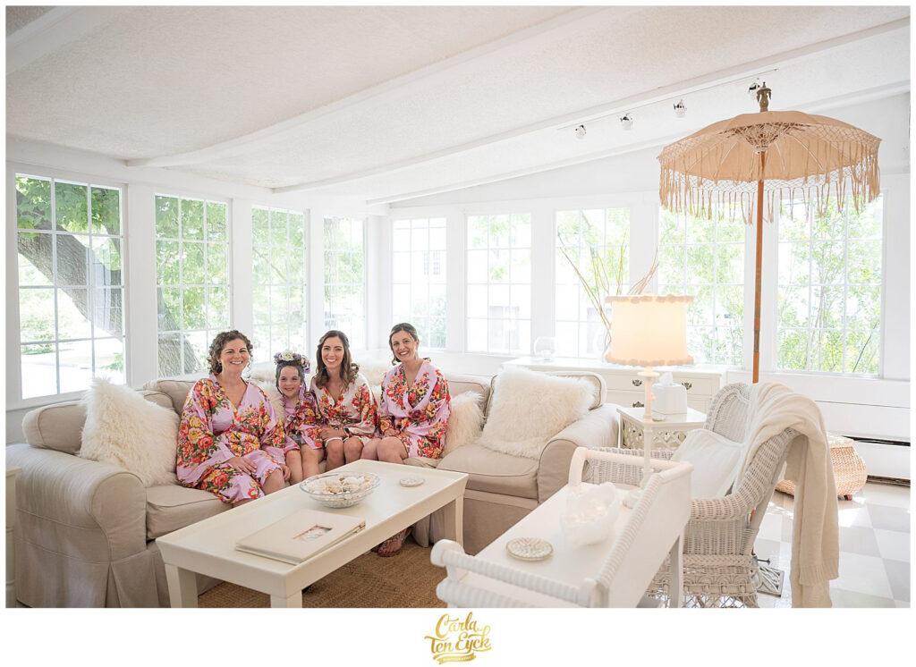A bride and her wedding party relax at her wedding at the Lord Thompson Manor in Thompson CT