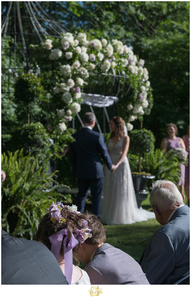 A bride and groom exchange their vows at their Lord Thompson manor wedding