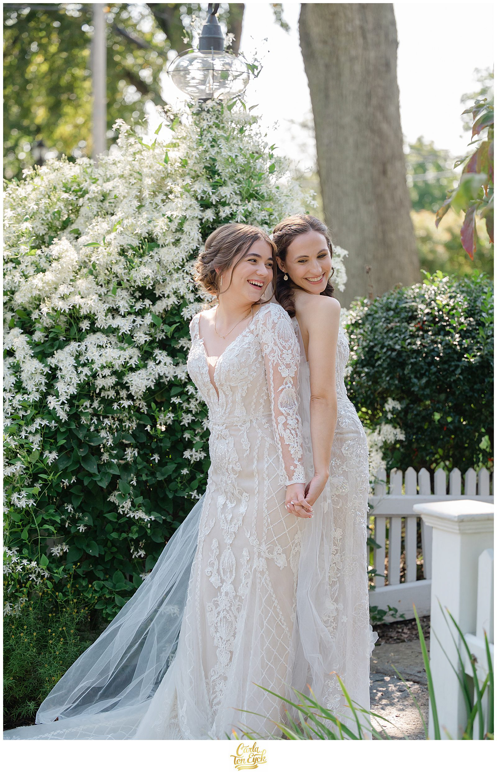 Two brides pose for their wedding photos at The Log Cabin Holyoke MA