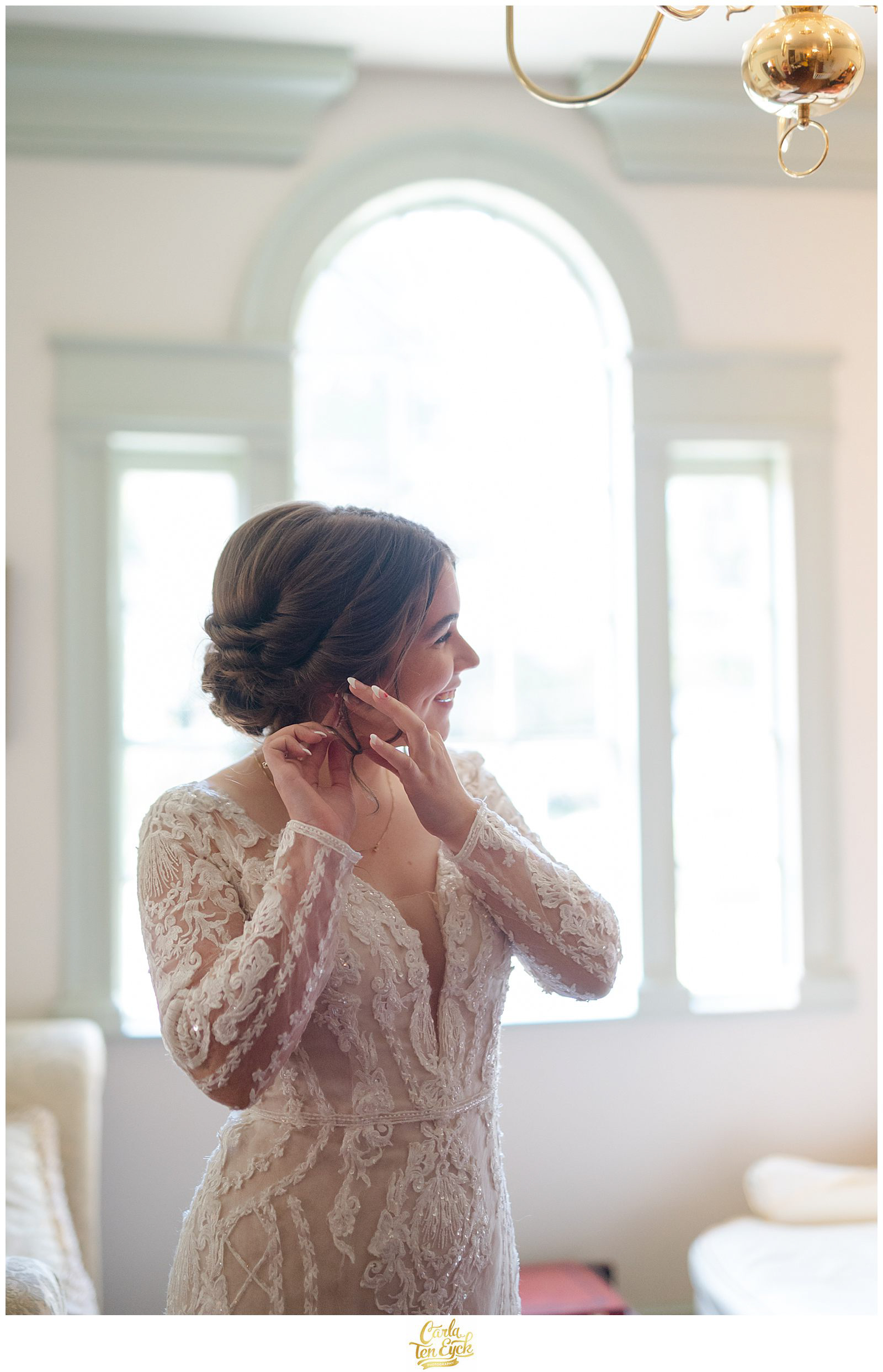 A bride gets ready for her wedding at the log cabin holyoke ma at the Daniel Stebbins House in South Hadley MA