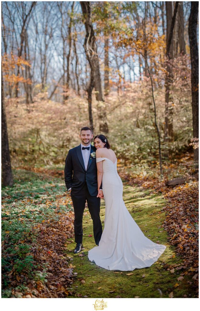 A bride and groom pose for photos at their wedding at Lord Thompson Manor in Thompson CT