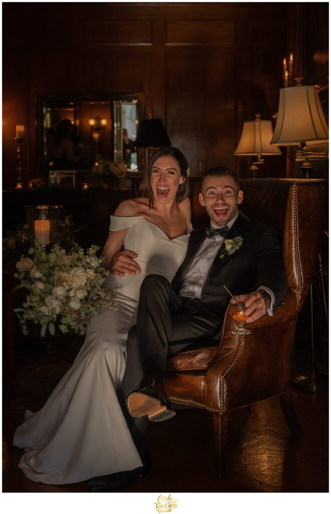 A bride and groom get silly during their photos at their wedding at Lord Thompson Manor in Thompson CT
