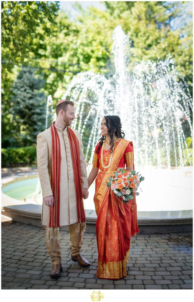 A bride and groom pose for photos during their Hindu and Jewish wedding at the VIP Country Club in New Rochelle NY