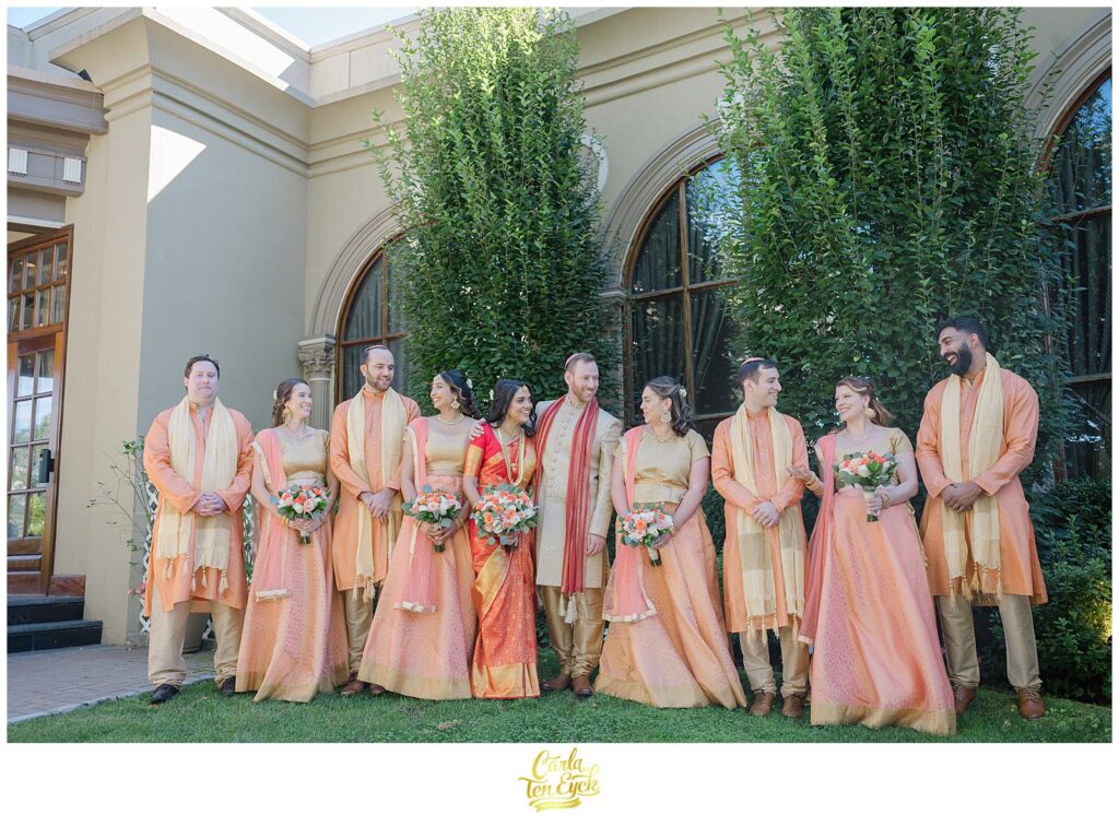 A hindu bride and Jewish groom with their wedding party at during their wedding at the VIP Country Club in New Rochelle NY