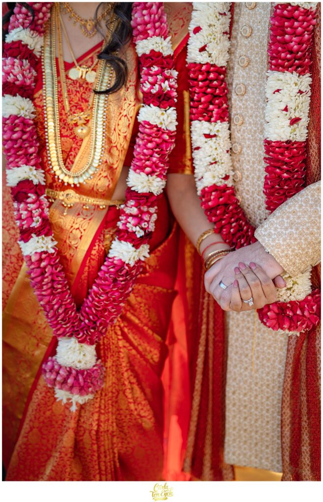 A hindu bride and her jewish groom  during their wedding at the VIP Country Club in New Rochelle NY
